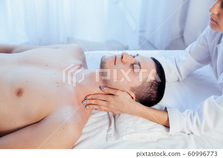 doctor cosmetologist doing facial massage men spa treatments doctor cosmetologist doing facial massage men spa treatments 60996773