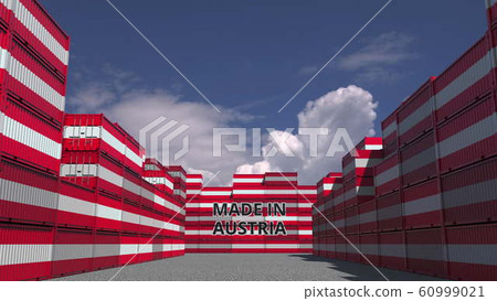 Many cargo containers with MADE IN AUSTRIA text and national flags. Austrian import or export related 3D rendering 60999021