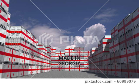 Containers with MADE IN GEORGIA text and national flags. Georgian import or export related 3D rendering 60999079