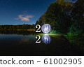 2020 written on the air with futuristic glowing ball 61002905