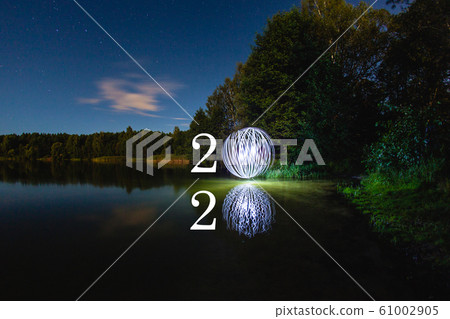 2020 written on the air with futuristic glowing ball 2020 written on the air with futuristic glowing ball 61002905