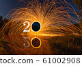 2020 written on the air with flying burning sparks 61002908
