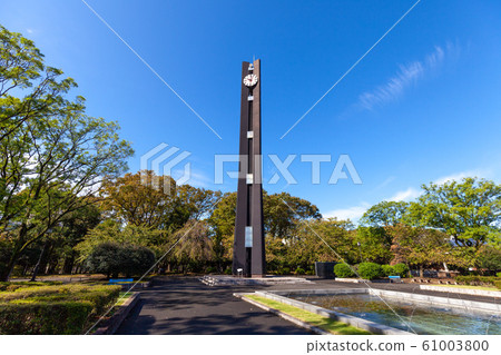 In front of the Diet Clock tower at the constitutional memorial park (side view, sunshine, blue sky background) In front of the Diet Clock tower at the constitutional memorial park (side view, sunshine, blue sky background) 61003800