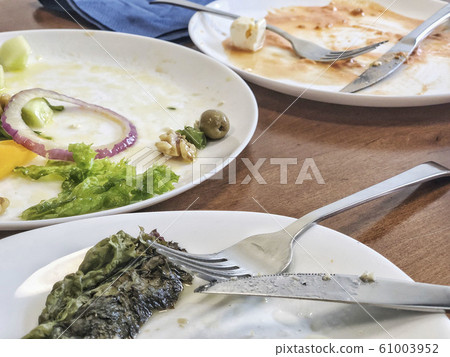 leftovers of a salad on table 61003952