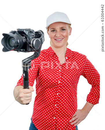 woman videographer using steady cam, 61004442