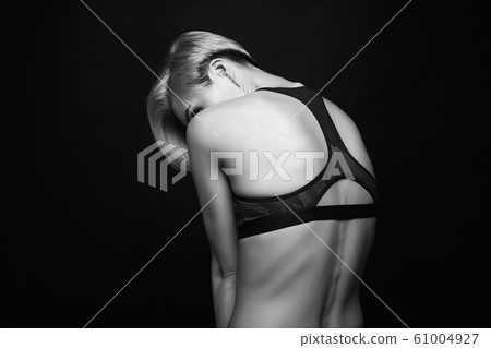 beautiful female back. beautiful sad blonde woman 61004927