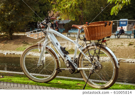 Bicycle Parked On City Street. A city bike in Dusseldorf. Urban bike parked without anyone on European street. Bicycle ecological mode of transport in Europe. Dusseldorf, Germany 61005814