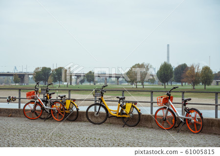 Bicycle Parked On City Street. A city bike in Dusseldorf. Urban bike parked without anyone on European street. Bicycle ecological mode of transport in Europe. Dusseldorf, Germany 61005815