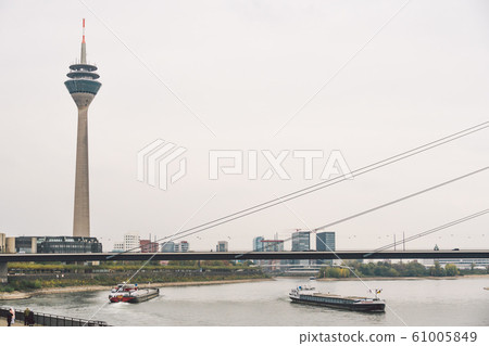 25 October 2018 Germany, Dusseldorf. TV tower, sightseeing in the city center in the fall in cloudy weather. Rhine Tower Rheinturm in Dusseldorf. It is the tallest building 61005849