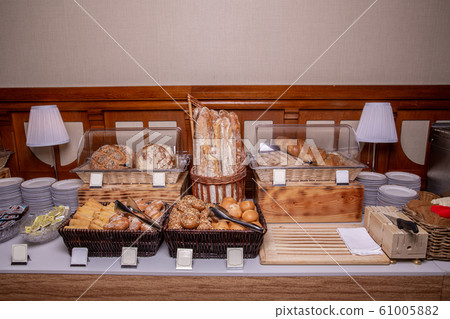 Bread table with buns and pastries 61005882