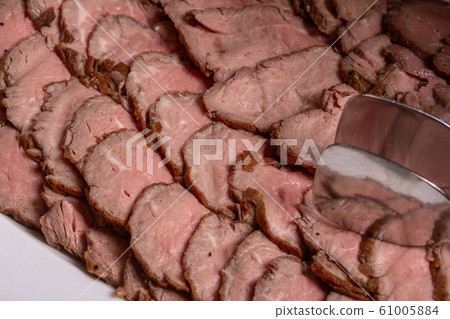 Meat freshly frozen with pieces on a plate 61005884