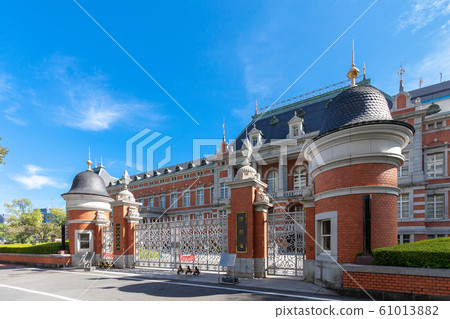 The former main building of the Ministry of Justice red brick building exterior and a characteristic gate, with the blue sky in the background The former main building of the Ministry of Justice red brick building exterior and a characteristic gate, with the blue sky in the background 61013882
