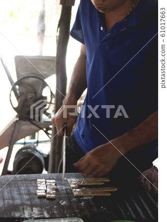 Coconut candy factory in My Tho city, Vietnam Coconut candy factory in My Tho city, Vietnam 61017663