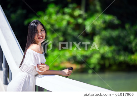 Close-Up Portrait Of Beautiful Asian Smiling Girl Close-Up Portrait Of Beautiful Asian Smiling Girl 61017906
