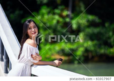 Close-Up Portrait Of Beautiful Asian Girl at sunny Close-Up Portrait Of Beautiful Asian Girl at sunny 61017907