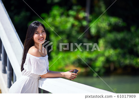 Close-Up Portrait Of Beautiful Asian Smiling Girl Close-Up Portrait Of Beautiful Asian Smiling Girl 61017909