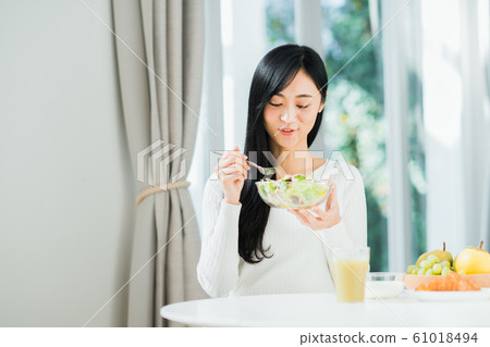 Young lady (breakfast) Young lady (breakfast) 61018494