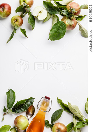 Apple cider vinegar and fresh apples, flat lay, space for your text 61019091