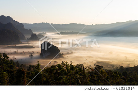 Beautiful scenery in northern Thailand ,Phu Lung Kha,mountain With Sunrise provides beautiful colors on the mist in the meadow. Beautiful scenery in northern Thailand ,Phu Lung Kha,mountain With Sunrise provides beautiful colors on the mist in the meadow. 61021014