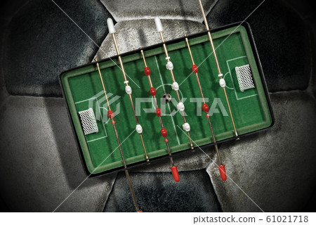 Foosball - Mini table football game on an old soccer ball 61021718