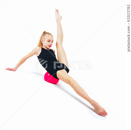 Girl gymnast with a red sword slides Girl gymnast with a red sword slides 61023761