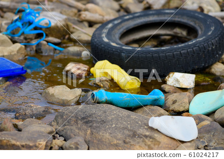 Plastic and styrofoam pollution from ocean on beach. Dirty spilled garbage waste on sea shore. Plastic and styrofoam pollution from ocean on beach. Dirty spilled garbage waste on sea shore. 61024217