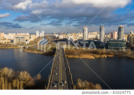 City Traffic on the Patona Bridge. View of Rusanovskaya Embankment. 61024775
