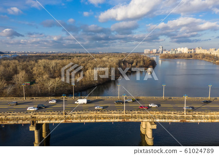 Beautiful Aerial View of City Traffic on the Bridge at the Sunny Day in winter. 61024789