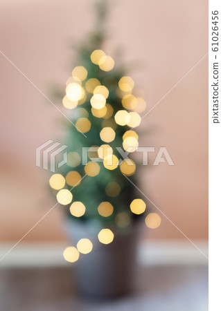 Defocused background Living room with christmas tree. Pink toned Defocused background Living room with christmas tree. Pink toned 61026456