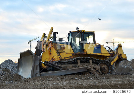 Bulldozer during of large construction jobs at building site. 61026673