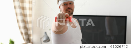 Young attractive man engaged in fitness 61026742