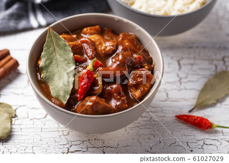 Curry chicken tikka masala with rice Curry chicken tikka masala with rice 61027029
