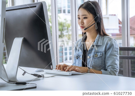 Call Center Asian women are providing business Call Center Asian women are providing business 61027730