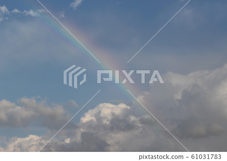 Rainbow and blue sky 61031783