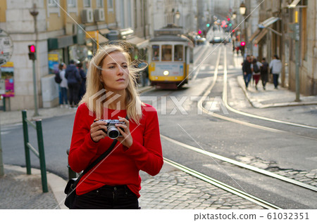 Blonde girl in the city of Lisbon 61032351