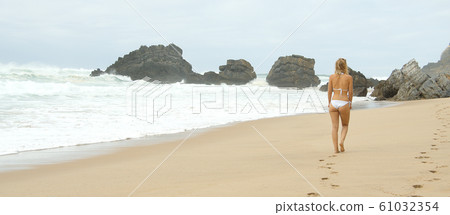 Wild Atlantic ocean coast at Adraga Beach in Portugal 61032354