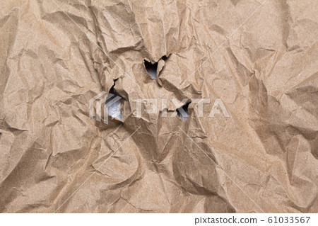 Close up of crumpled brown paper texture and torn. Close up of crumpled brown paper texture and torn. 61033567