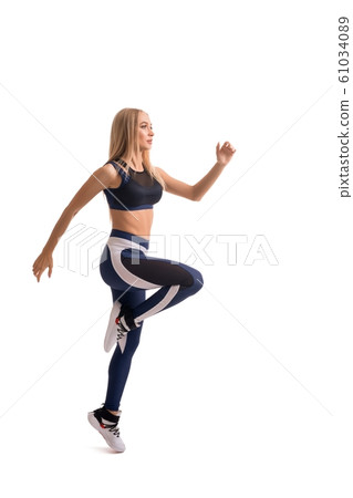 Beautiful fitness model exercising isolated shot 61034089
