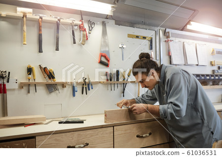 Repairman working with wood Repairman working with wood 61036531