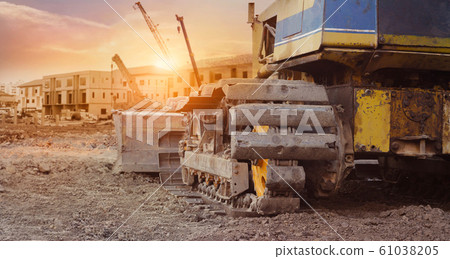 Construction equipment in construction new building background, excavator with crane on construction site. Construction equipment in construction new building background, excavator with crane on construction site. 61038205