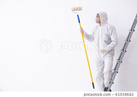 Painter working at construction site Painter working at construction site 61038682
