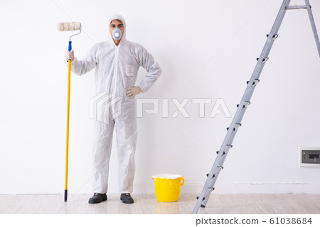 Painter working at construction site Painter working at construction site 61038684