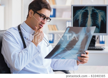 The doctor radiologist looking at x-ray images 61040385