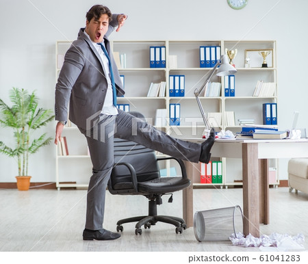 Businessman having fun taking a break in the office at work Businessman having fun taking a break in the office at work 61041283