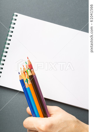 Colored pencils in hand Colored pencils in hand 61041566