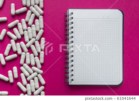 Pills and notebook 61041644