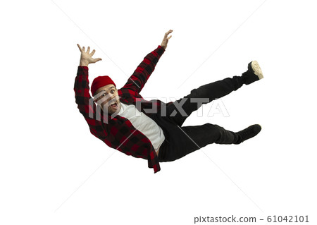 A second before falling - young man falling down with bright emotions and expression A second before falling - young man falling down with bright emotions and expression 61042101