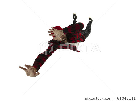 A second before falling - young man falling down with bright emotions and expression 61042111