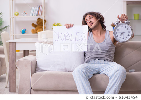 Unemployed man desperate at home Unemployed man desperate at home 61043454