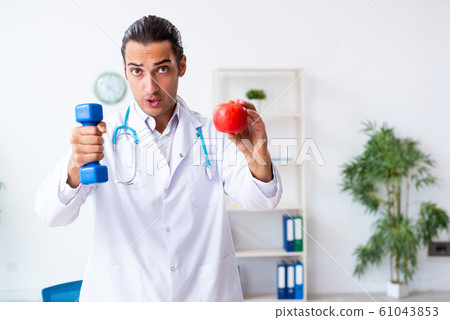 Young male doctor in sport and dieting concept Young male doctor in sport and dieting concept 61043853